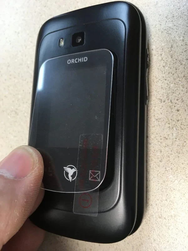 Applying the outer screen protector for F1 Pro flip phones, image 1.
