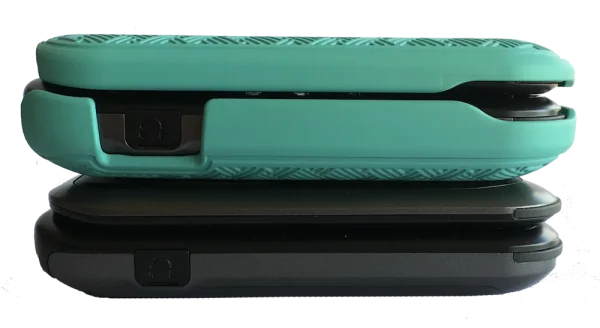 A side view of one F1 Pro flip phone in a hard shell cover and one without a cover.