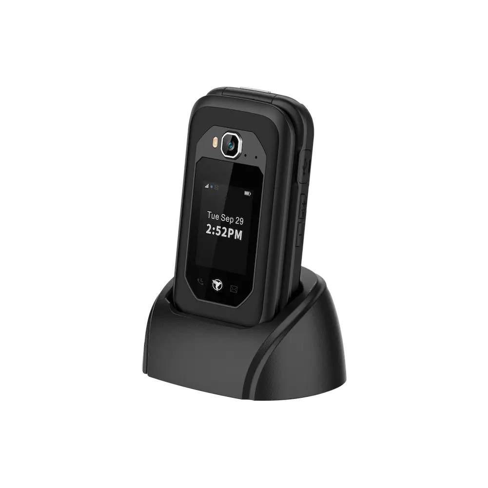 The Sunbeam Wireless F1 Pro rugged dumbphone in a charging dock.